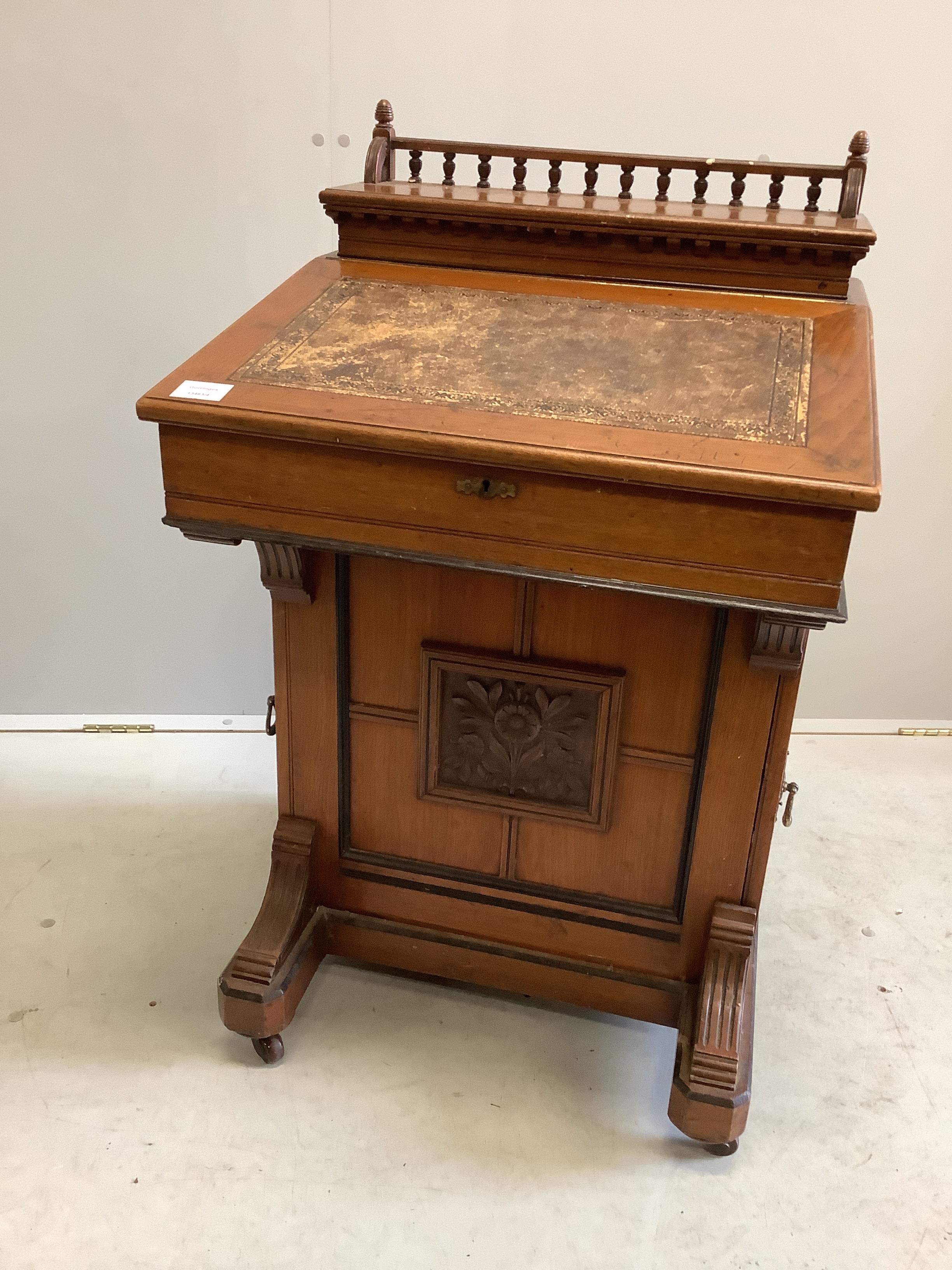 A late Victorian Aesthetic movement mahogany davenport by Jas. Shoolbred & Co., width 56cm, depth 56cm, height 94cm